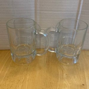Set of 2 clear mugs about 4 1/2 inches tall. Great for hot chocolate